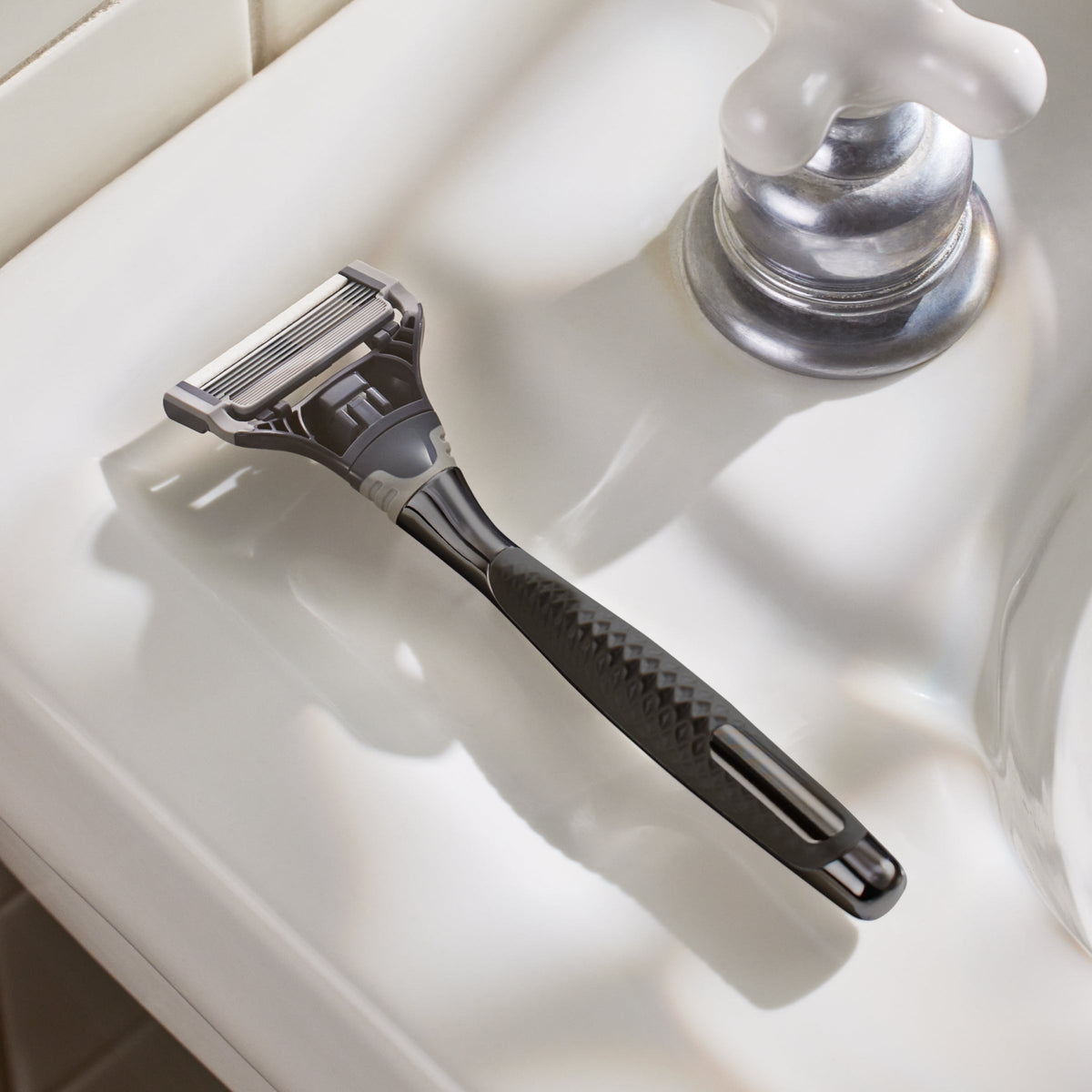 Graphite Original handle on a bathroom sink.